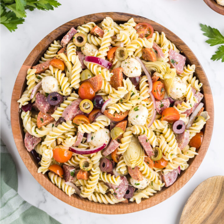 antipasto pasta salad in a wooden bowl