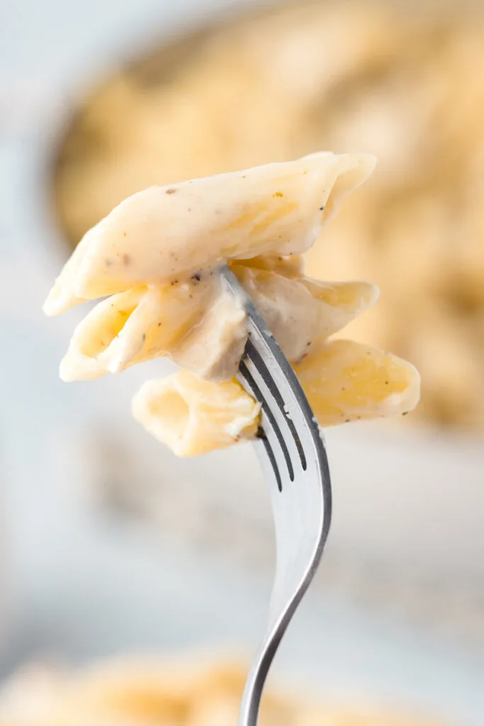 bite of easy chicken alfredo pasta on a fork