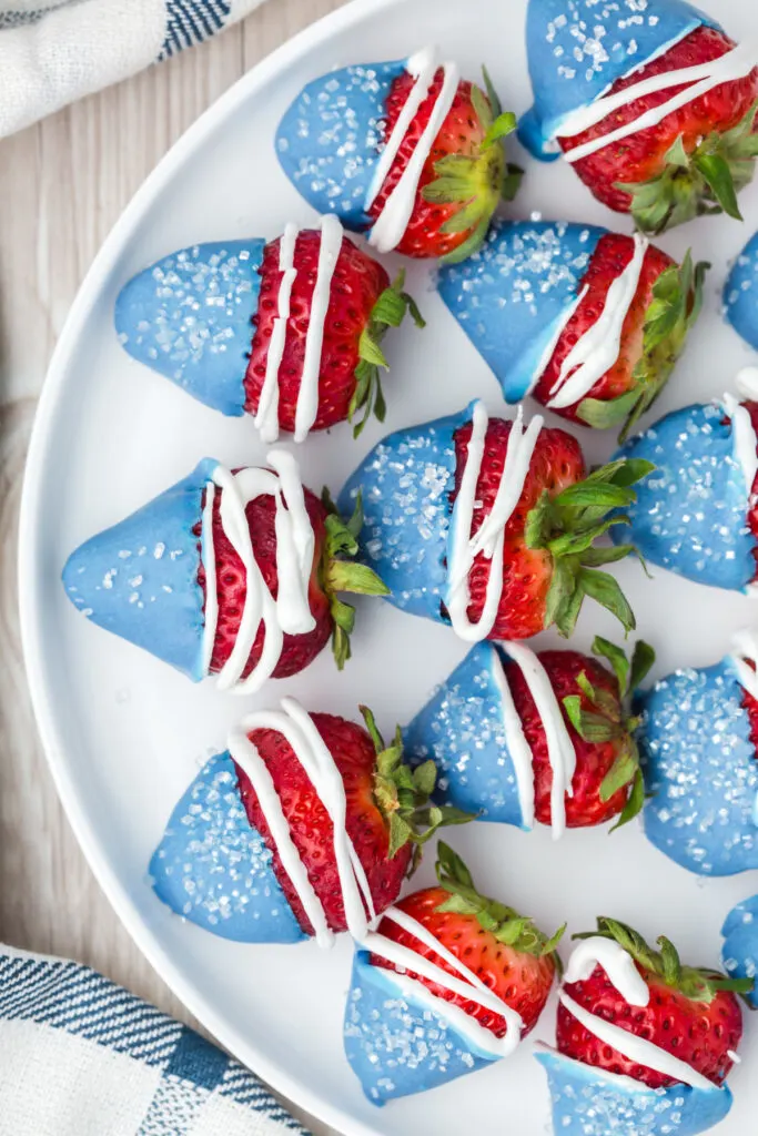 patriotic strawberries on white serving platter